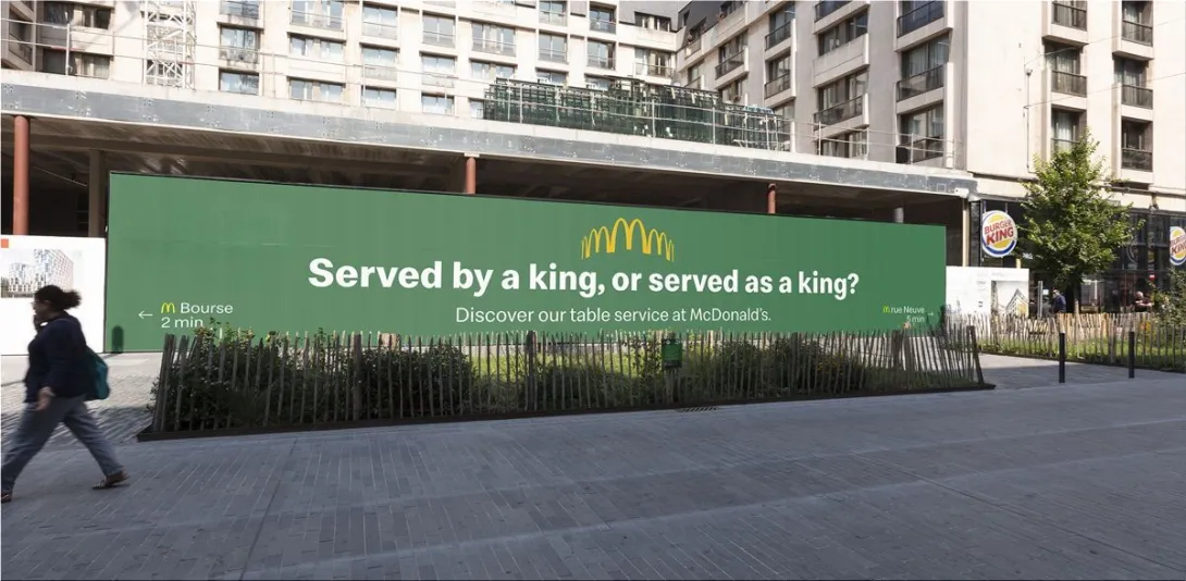 McDonald's "Served by a king, or served as a king?"