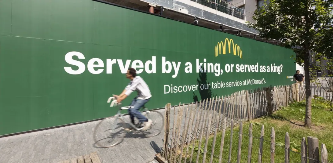 McDonald's "Served by a king, or served as a king?"